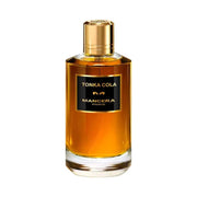 Tonka Cola Mancera fragrance bottle with amber liquid for women and men.
